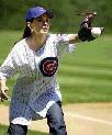 Shania warms up to throw out the ceremonial first pitch of the Chicago Cubs-Philadelphia Phillies game at Wrigley Field in Chicago, Thursday, July 24, 2003